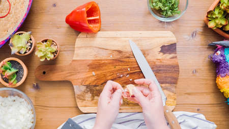Step by step. Slicing vegetables for filling to make empanadas.の写真素材