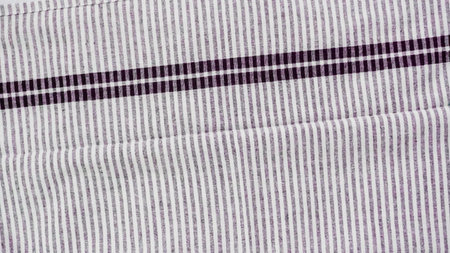Folding Blck and white patterned paper towels on marble surface.