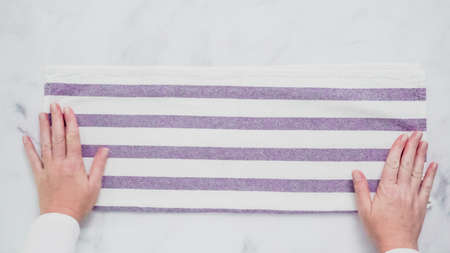 Folding blue and white patterned paper towels on marble surface.の写真素材