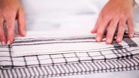 Folding Blck and white patterned paper towels on marble surface.の写真素材