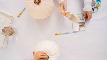 Step by step. Decorating Halloween craft pumpkin with unicorn theme.の写真素材