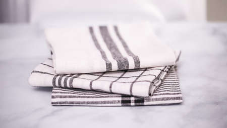 Folding Blck and white patterned paper towels on marble surface.の写真素材