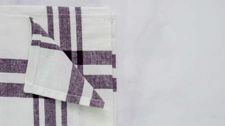 Folding Blck and white patterned paper towels on marble surface.の写真素材