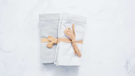 New linen dinner napkin on marble countertop.の写真素材