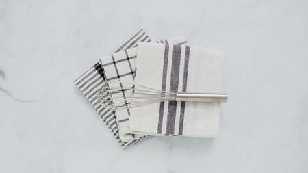 Folding Blck and white patterned paper towels on marble surface.の写真素材