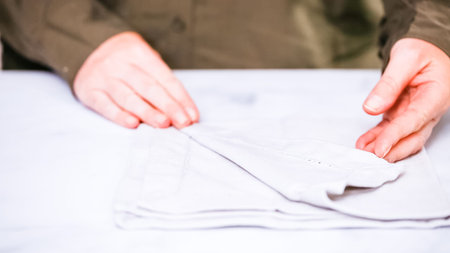 New linen dinner napkin on marble countertop.の写真素材