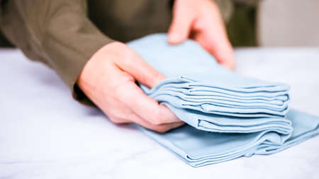 New linen dinner napkin on marble countertop.の写真素材