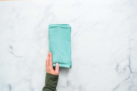Stack of new linen dinner napkin on the kitchen counter.の写真素材