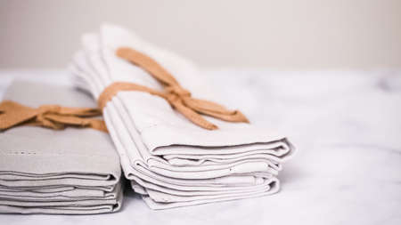 New linen dinner napkin on marble countertop.の写真素材