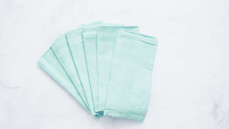 New linen dinner napkin on marble countertop.の写真素材