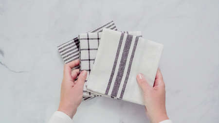 Folding Blck and white patterned paper towels on marble surface.の写真素材