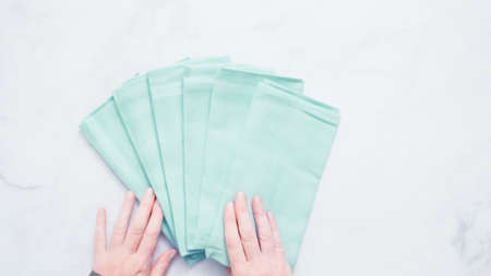 New linen dinner napkin on marble countertop.の写真素材