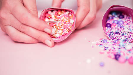 Colorful sprinkle blend on a pink background.の写真素材