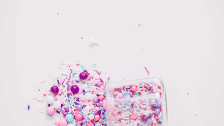 Colorful purple sprinkle blend on a white background.の写真素材