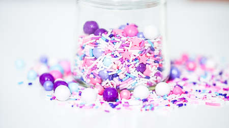 Colorful purple sprinkle blend on a white background.の写真素材
