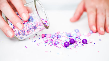 Colorful purple sprinkle blend on a white background.の写真素材