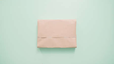 Wrapping kids present in brown paper.の写真素材