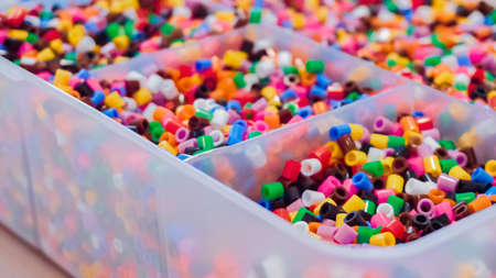Plastic container with colorful kids beads.の写真素材