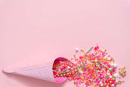 Colorful pink sprinkle blend on a pink background.の写真素材