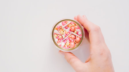Colorful pink sprinkle blend on a white background.の写真素材