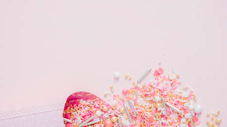 Colorful pink sprinkle blend on a pink background.の写真素材