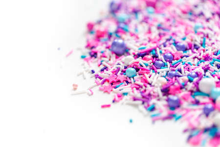 Colorful purple sprinkle blend on a white background.の写真素材