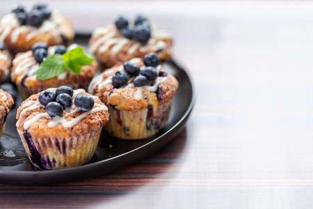 Homemade blueberry muffins made with organic ingredients.の写真素材