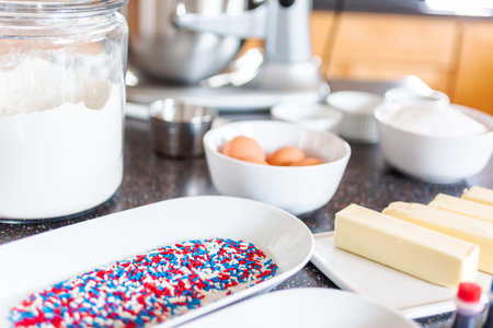 Step by step. Ingredients to bake sugar cookies on the kitchen counter.