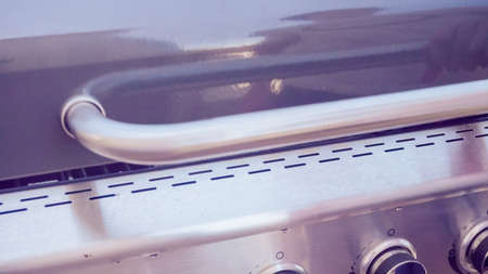 Step by step. Outdoor gas grill on back patio in the Summer.の写真素材