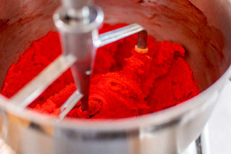 Step by step. Mixing dough for red white and blue pinwheel cookies.の写真素材