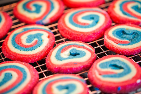 Red white and blue pinwheel sugar cookies for July 4th celebration.