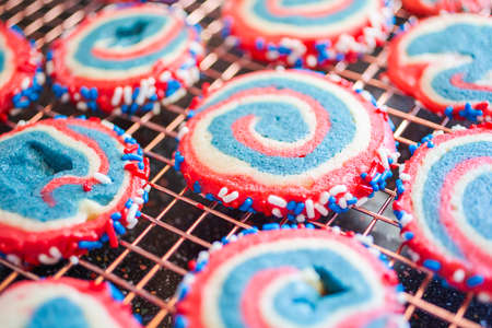 Red white and blue pinwheel sugar cookies for July 4th celebration.の写真素材
