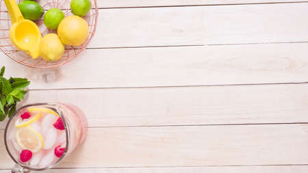 Step by step. Preparing raspberry lemonade with fresh lemons and raspberries in drinking mason jars.の写真素材