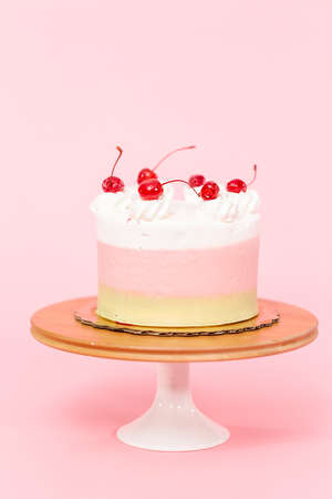 Birthday Spumoni cake on pink background.の写真素材