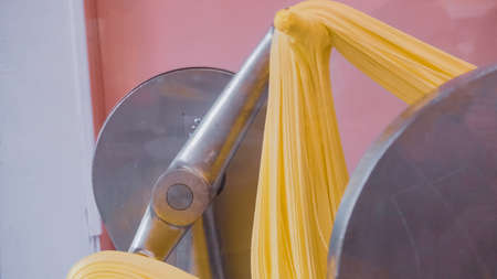 Making yellow salt water taffy in small candy shop.の写真素材