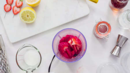 Step by step. Preparing Kentucky kiss burbon cocktail with fresh organic strawberries.の写真素材