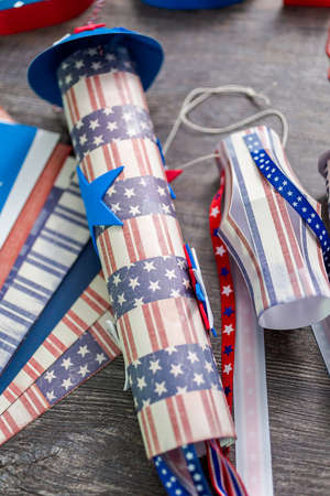 Paper firecrackers made from red, white and blue paper for July 4th celebration.の写真素材
