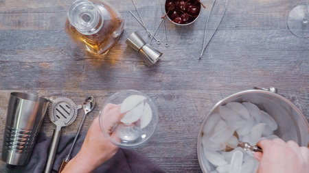 Step by step. Preparing Manhattan cocktail at home bar.