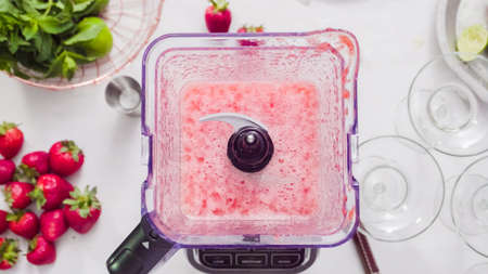 Step by step. Preparing strawberry margarita from fresh organic strawberries.の写真素材