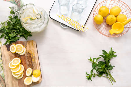 Sliced organic lemon on wood cutting board.の写真素材