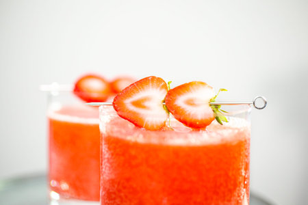 Kentucky kiss burbon cocktail garnished with fresh strawberries.の写真素材