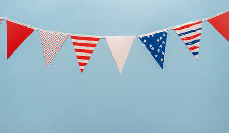 July 4th theme paper garland on blue background.の写真素材