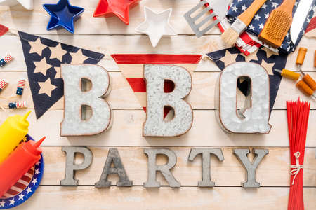 BBQ Time sign with July 4th decorations on a wood boards.の写真素材
