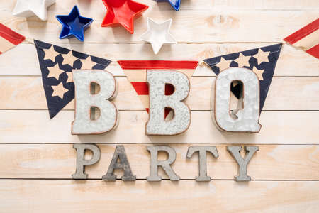 BBQ Time sign with July 4th decorations on a wood boards.の写真素材
