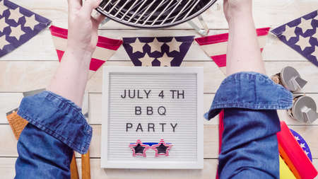 July 4th BBQ Party sign on memo board with July 4th decorations.の写真素材