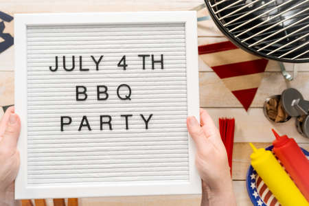 July 4th BBQ Party sign on a white mamo board.の写真素材