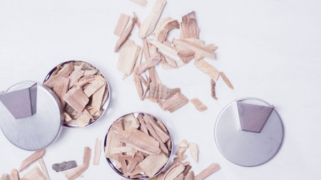 Stainless steel smoking pucks with smoking apple chips.