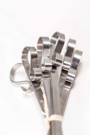 New steel skewers on white wood table.の写真素材