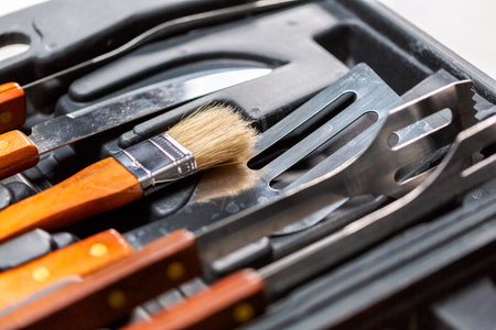 Simple BBQ cooking set in plastic case.