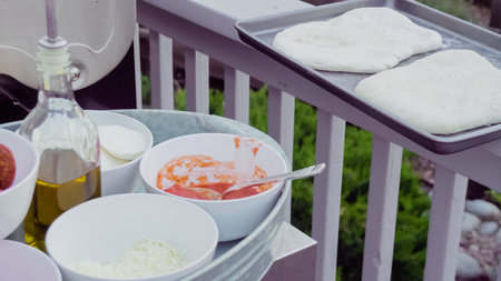 Cooking pizza on outdoor gas grill.の写真素材